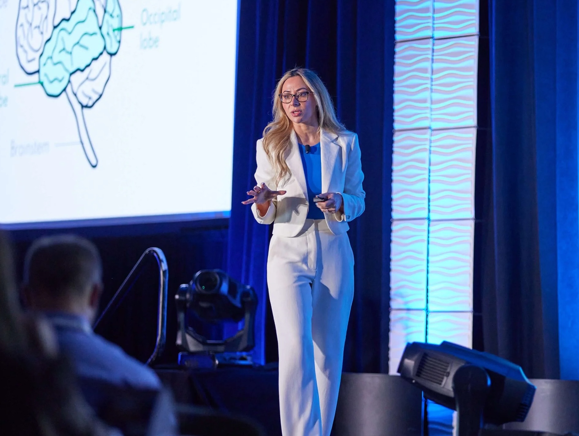 Dr. Sahar Yousef speaking on stage