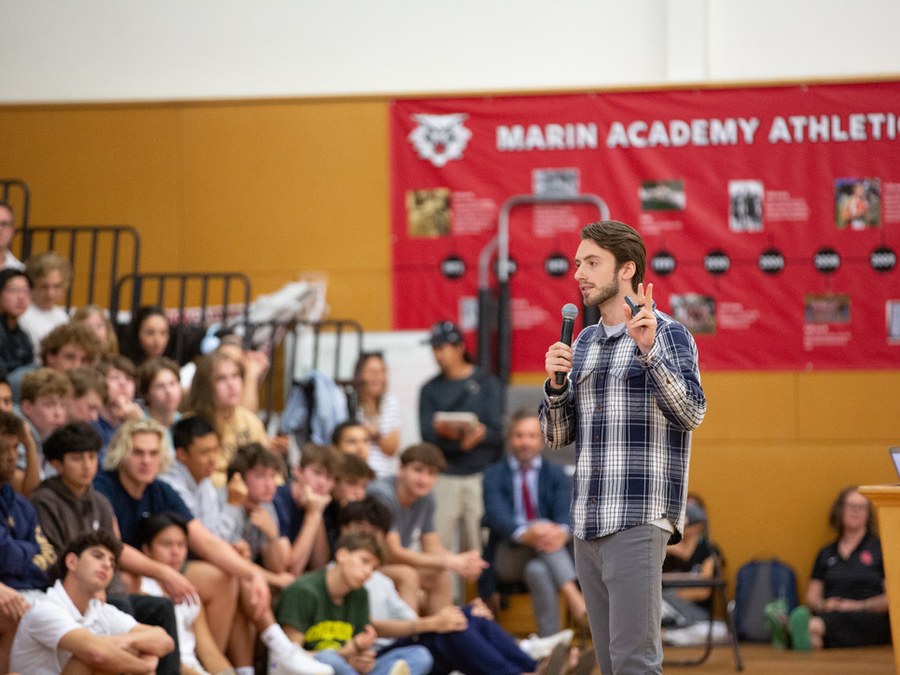 A Project Reboot speaker presenting to students at a Marin Academy assembly